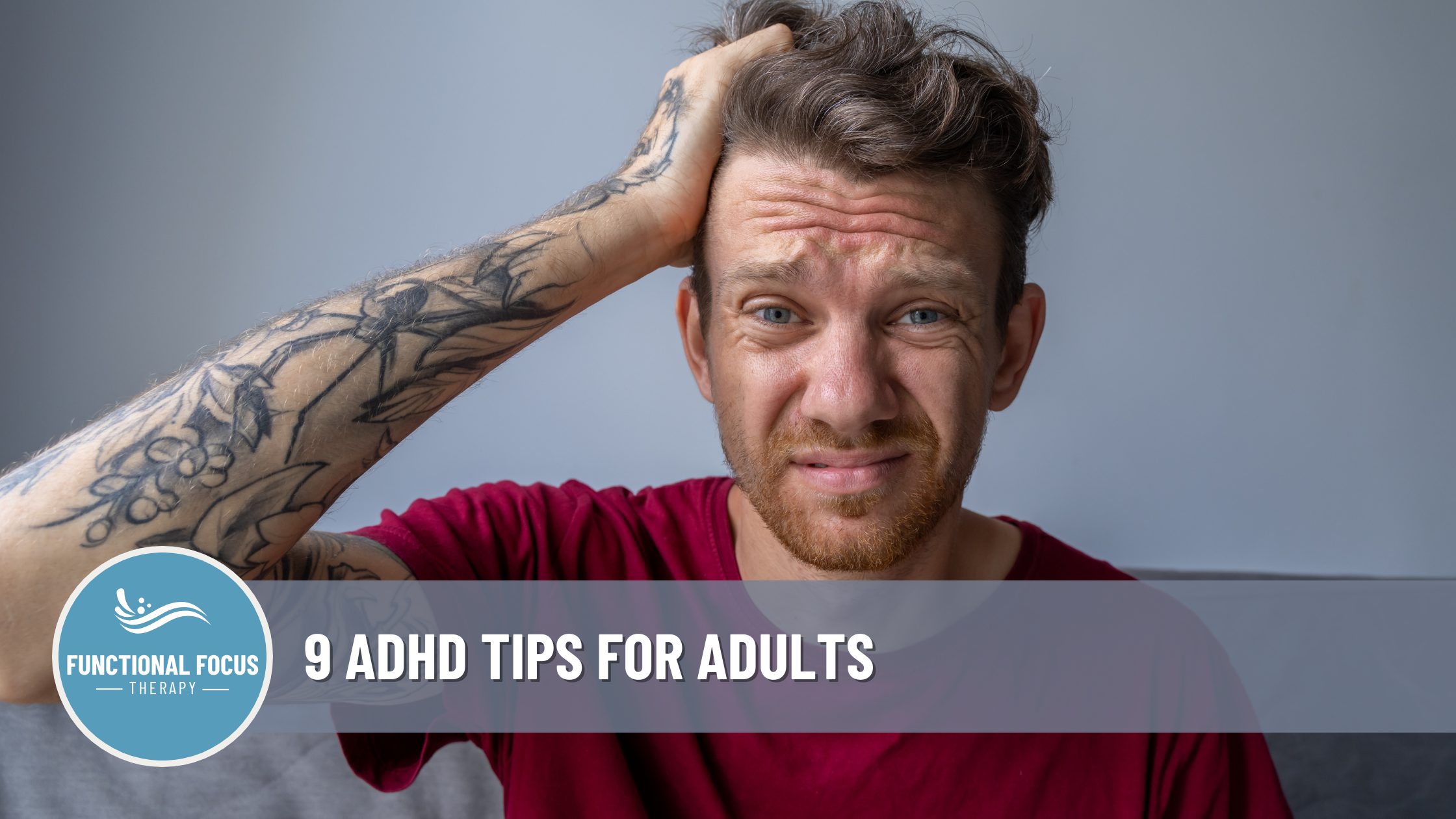 a man holding his head with his right arm experiencing adhd symptoms