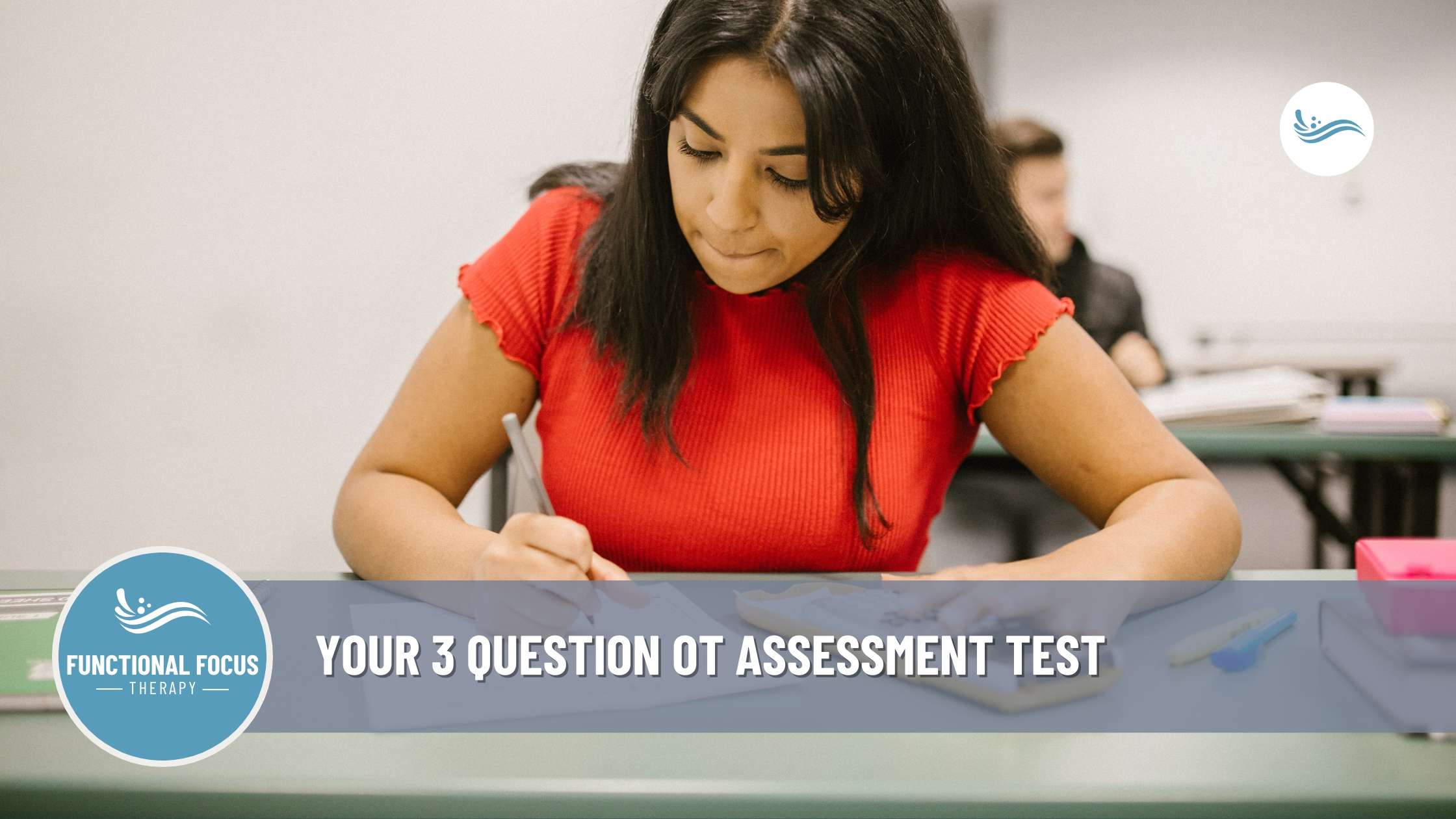 A woman sitting at a desk with a pen, preparing to take an Occupational Therapy Assessment test.