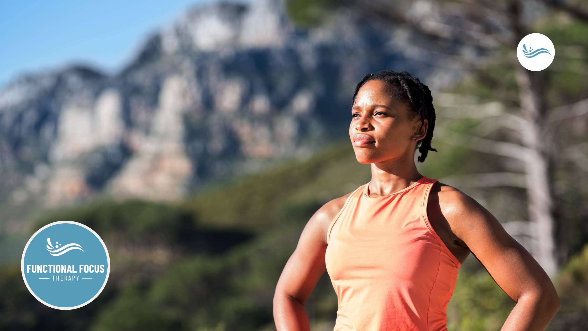 A runner pausing confidently on a mountain trail